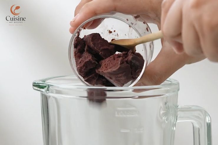 Add the frozen fruit first